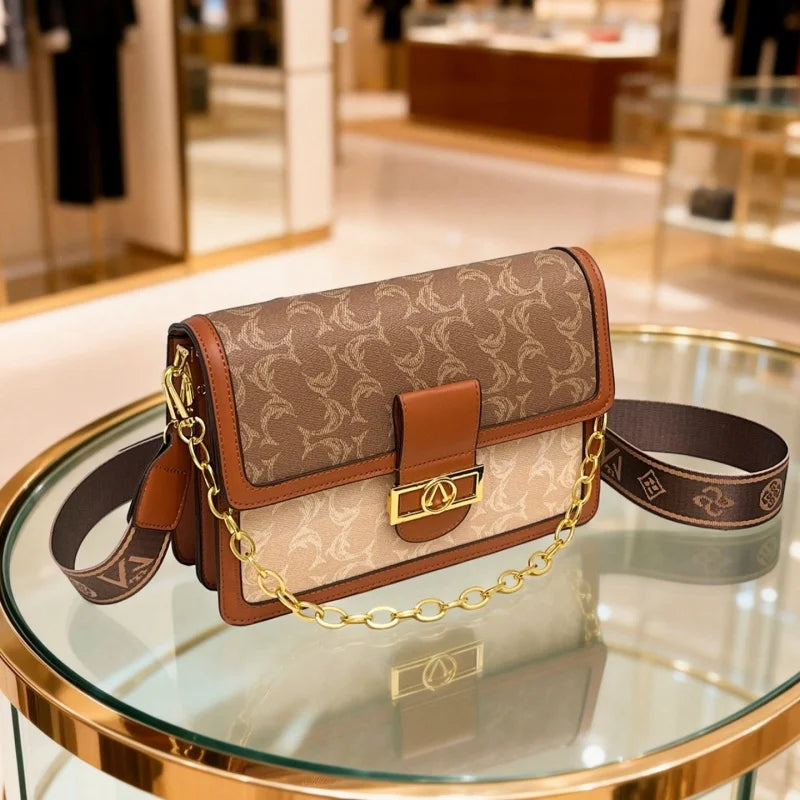 The Turn-Lock Crossbody — Structured Statement Bag