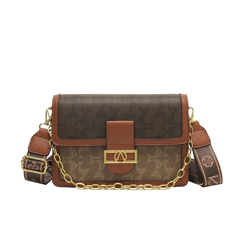 The Turn-Lock Crossbody — Structured Statement Bag