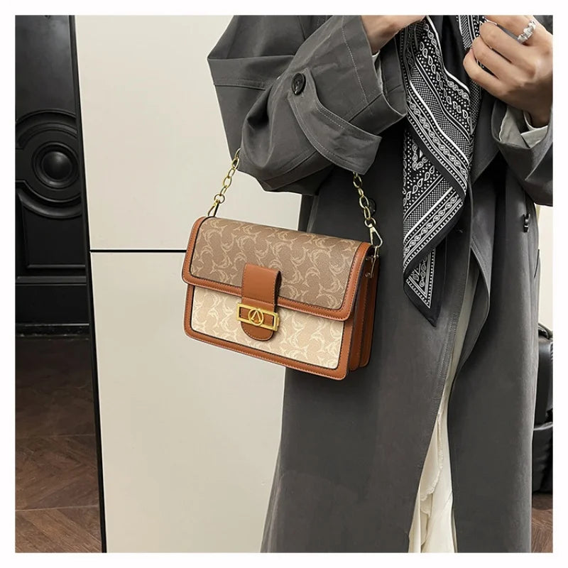 The Turn-Lock Crossbody — Structured Statement Bag
