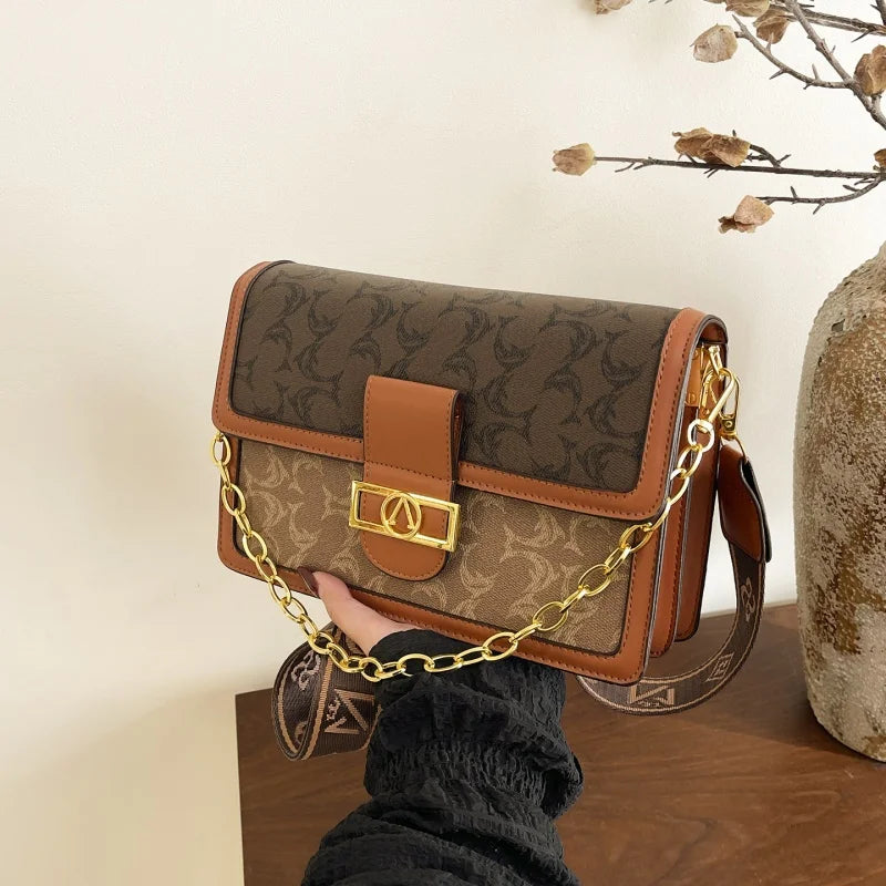 The Turn-Lock Crossbody — Structured Statement Bag