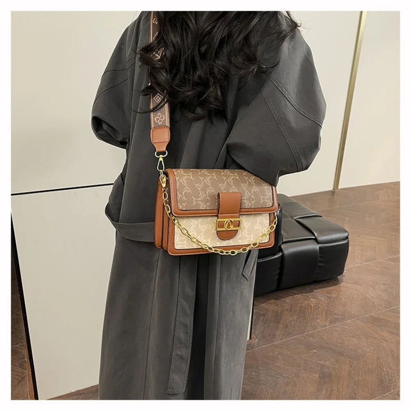 The Turn-Lock Crossbody — Structured Statement Bag