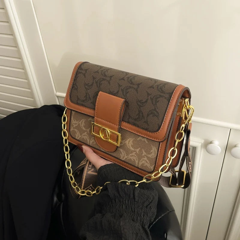 The Turn-Lock Crossbody — Structured Statement Bag